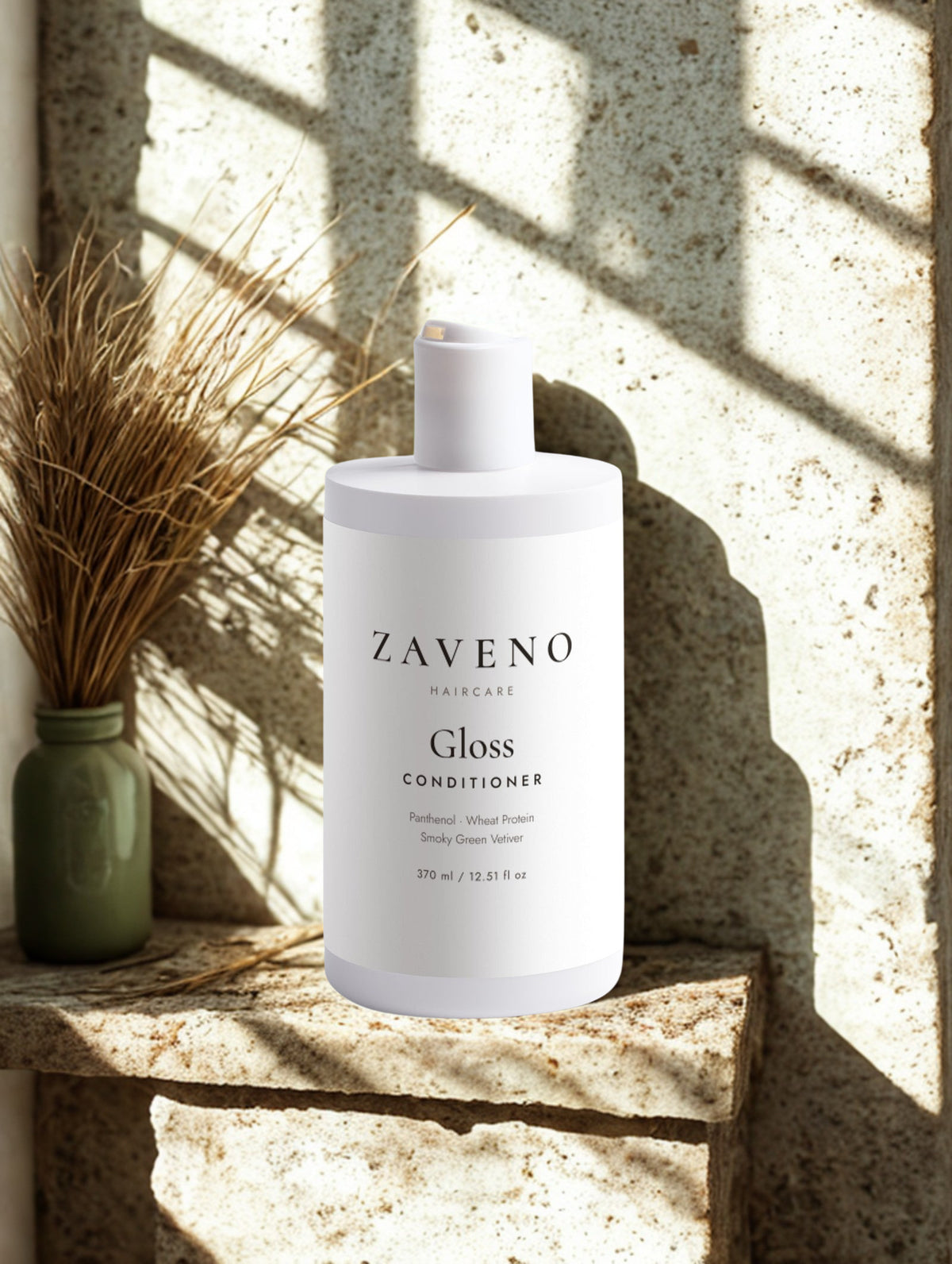 ZAVENO Gloss Conditioner on a stone ledge with dried vetiver