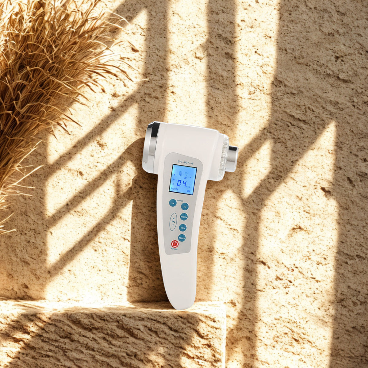 Ultrasonic Facial Device on a travertine ledge in warm window light
